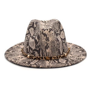 Detail of gray snakeskin fedora hat with leopard band and gold star metal accents