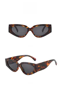 Front and side views of vintage tortoiseshell cat-eye sunglasses with gray lenses