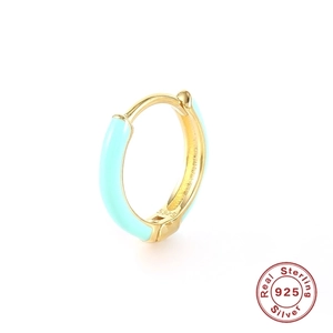 Macro shot of S925 sterling silver hoop earring with light blue enamel and gold finish