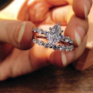 Close-up of s925 silver bridal ring set with marquise and round cut cubic zirconia