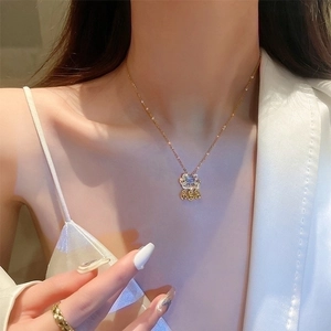 Elegant 18K gold plated titanium necklace with blue gemstone lock pendant and pearls