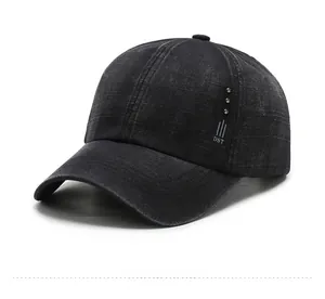 Detail view of washed cotton baseball cap featuring metal rivets and DST logo embroidery