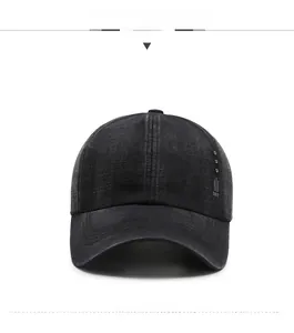 Close-up of black washed denim baseball cap featuring three silver studs and DST logo