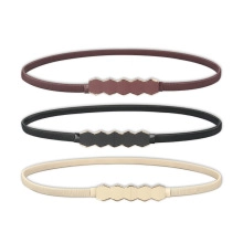 Three elastic skinny belts in dark brown, black, and beige with hexagonal metal buckles