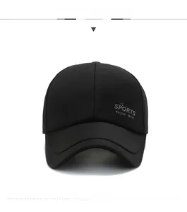 Detail shot of black sports baseball cap showing sports lettering and matte twill fabric