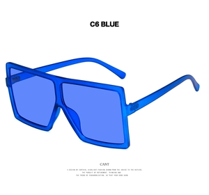 Macro side view of oversized square frame sunglasses in translucent bold blue color