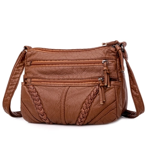 Brown soft leather crossbody bag for women with multi-zipper pockets and woven details