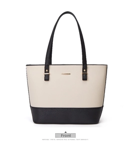 Front view of black and white tote bag with lychee texture and gold metal accents