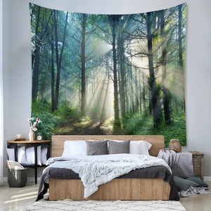 Detail of forest sunbeam tapestry hanging as a wall decoration in a modern bedroom