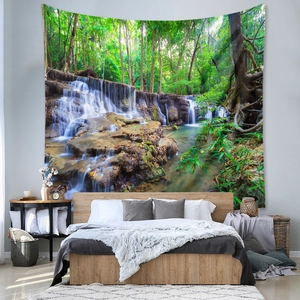 Detail showing forest waterfall tapestry on a bedroom wall with cozy wooden furniture