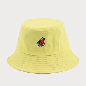 Close-up of yellow cotton bucket hat with detailed watermelon popsicle embroidery