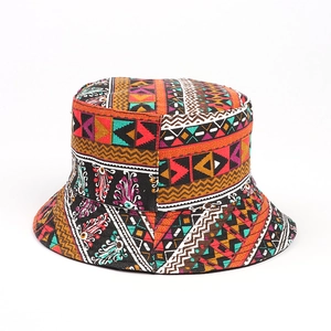 Close-up of Bohemian bucket hat with colorful geometric patterns on durable canvas fabric