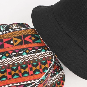 Reversible bucket hat for women with bohemian geometric print and solid black cotton
