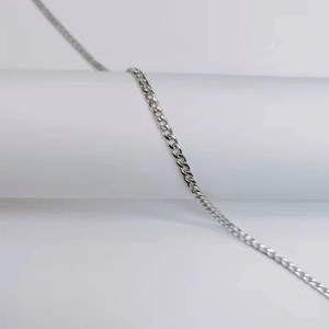 Close-up of polished silver stainless steel Cuban chain links with high quality finish