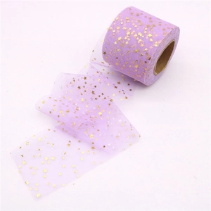 Purple tulle ribbon roll with gold foil star pattern for DIY hair bows and dress crafts