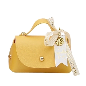 Elegant yellow faux leather wedding favor gift bag with golden snap and ribbon bow