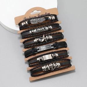 Set of 6 woven leather bracelets featuring skull, star, and feather metal charms
