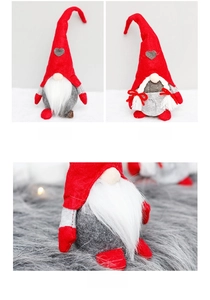 Close-up of Christmas gnome plush dolls with heart hats and detailed white beards and braids