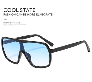 Macro shot of oversized black sunglasses frames with premium blue gradient lenses details