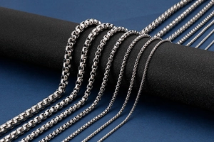 Macro view of polished stainless steel box chains in multiple widths and sizes
