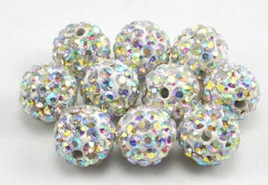 Macro detail of disco clay beads with shimmering AB crystals for DIY jewelry projects