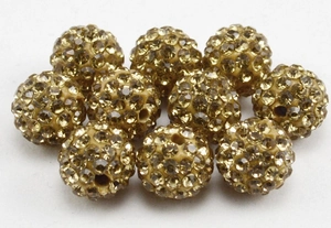 Macro view of champagne gold 10mm rhinestone clay beads for DIY jewelry making