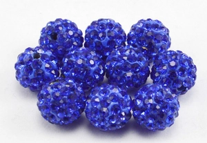 Macro view of 10mm dark blue disco ball clay beads with full rhinestone inlay for DIY