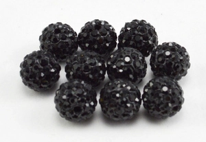 Macro shot of 10mm black Shamballa beads with faceted crystals in a grid layout