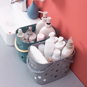 Green and grey plastic shower baskets with heart cutouts and ergonomic handles