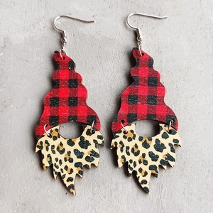 Detail view of gnome earrings with red-black plaid hats and leopard print beard details