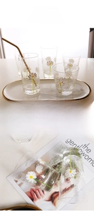 Detailed views of high borosilicate daisy print glassware set with hammer texture