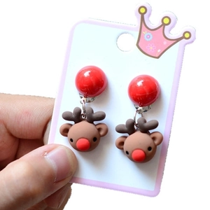 Close-up of resin Christmas reindeer earrings with red nose and festive decorative details