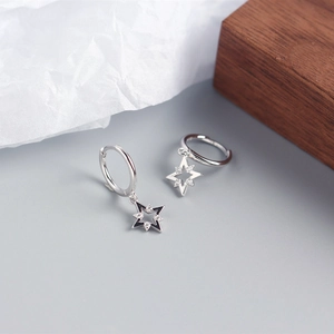 Detail view of S925 sterling silver geometric star earrings with sparkling zircon stones