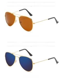 Detail view of gold aviator sunglasses with tea and blue mercury reflective lenses