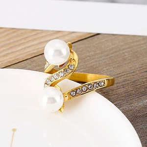 Elegant gold S-shaped napkin ring with large pearls and sparkling crystal rhinestones
