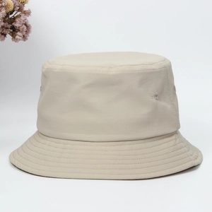 Close-up of beige quick-dry bucket hat with windproof rope on a clean white background