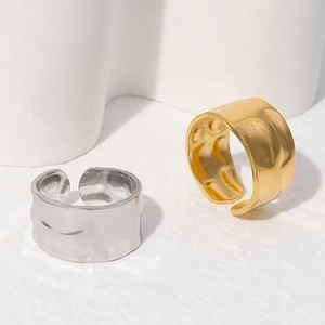 Minimalist wide open rings with hammered texture in gold and silver stainless steel