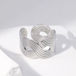 Adjustable wide band stainless steel ring with hollow wave patterns in silver finish