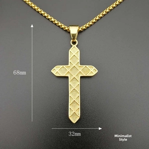 Macro shot of 68mm gold-plated hip-hop cross pendant with diamond-cut geometric texture