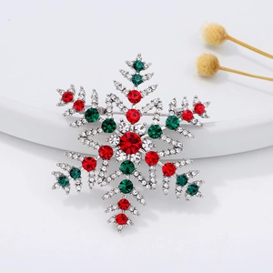 Christmas snowflake brooch with red, green and white rhinestones on silver alloy base
