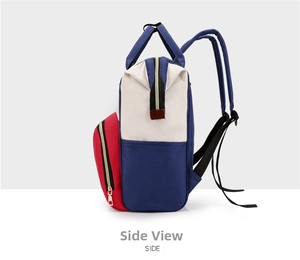 Side view of multi-color oxford cloth diaper bag showing side pockets and red front pocket