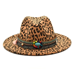 Detail of leopard print fedora with bohemian beaded band and turquoise stone ornament
