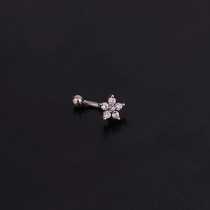 Detailed shot of a curved steel eyebrow ring with a sparkling zircon flower design