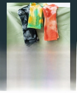Detail showing tie-dye cotton crew socks material composition and thickness index info