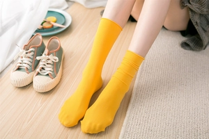 Detail shot of yellow ribbed cotton socks showing the breathable knit texture and cozy fit