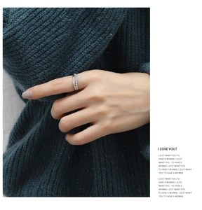 Close-up of a double-layer S925 silver ring featuring polished bands and zircon accents