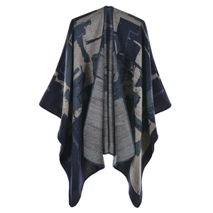 Detail of blue-grey knit shawl poncho with high-quality jacquard pattern and thick texture