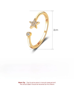 Detailed view of adjustable copper ring with star cubic zirconia and polished finish