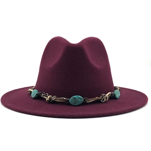 Close-up of wine red wool fedora hat featuring ethnic turquoise stone braided band
