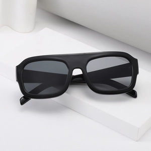 Classic black square oversized sunglasses with flat top and minimalist side logo on white steps